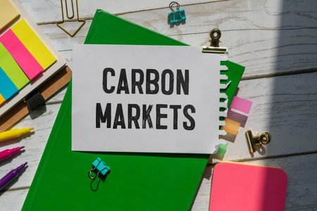 CARBON MARKETS. text on white paper near dollar bills.の写真素材