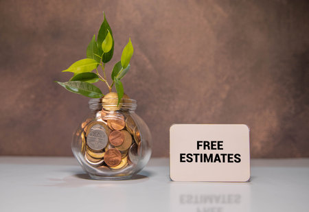 FREE ESTIMATES text on a yellow sticky on wooden backgroundの写真素材