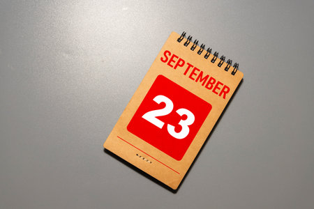 September 23rd. Image of september 23 wooden color calendar on white background. Autumn day. Empty...