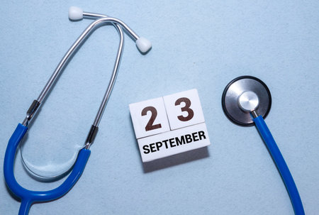 September 23rd. Image of september 23 wooden color calendar on white background. Autumn day. Empty space for textの写真素材