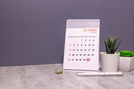 October 31st. Image of October 31 wooden color calendar on white background. Autumn day. Empty space for textの写真素材