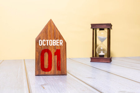 October 1st. Image of October 1 wooden color calendar on blue background. Autumn day. Empty space...