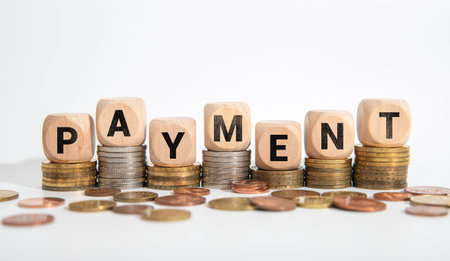 PAYMENT TERMS word on the yellow paper with office tools on the white background.