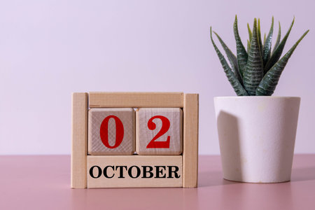 October 02 is commemorated as International Day of Non-Violence Day with a wooden calendar backgroundの写真素材