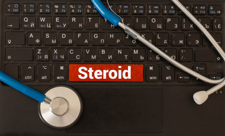 A wooden block with the word STEROID stands on a blue background among multi-colored pills. Medical conceptの写真素材