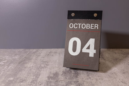 Wooden calendar with the date October 4.Monthly calendar for planning and management concept with...