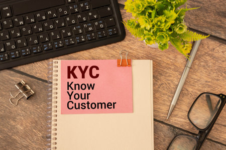 KYC Know Your Customer - guidelines in financial services to verify the identity, suitability, and risks, acronym text on notepadの写真素材