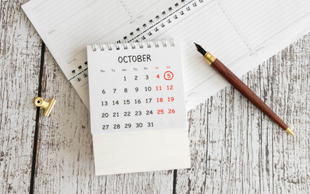 October 5th. Image of October 5 wooden color calendar on white background. Autumn day. Empty space...