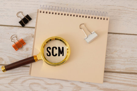 A colored wooden cubes with text SCM. SCM stands for Supply Chain Managementの写真素材