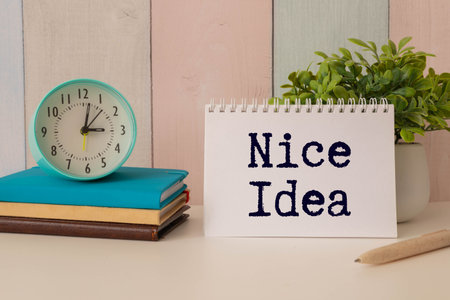 Have a Nice Day text with flowers decoration on yellow background