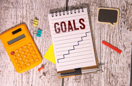 Goals Concept. Chart with keywords and icons. The meeting at the white office table