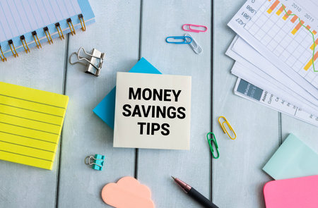 Money Saving Tips text messege and piggy bank on pink background