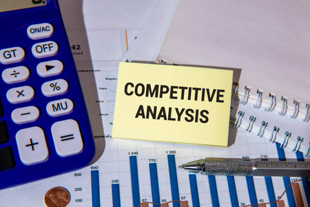 Notebook with Tools and Notes with text COMPETITOR ANALYSISの写真素材