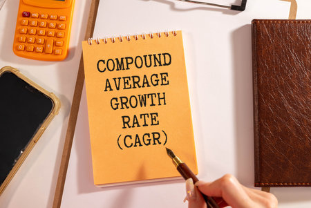 Wooden cube block with text CAGR on blue backgroundの写真素材