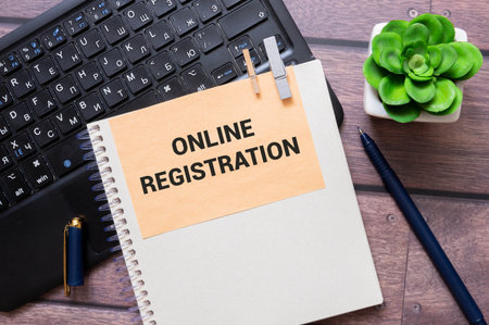 Online Registration on the paper isolated on it desk. Business and inspiration conceptの写真素材