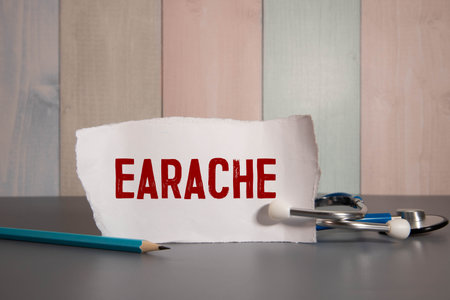 Earache, word cube with background.の写真素材