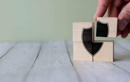 Wooden cube with an open and closed lock pattern. Day of protection of personal data. Protection of personal informationの写真素材