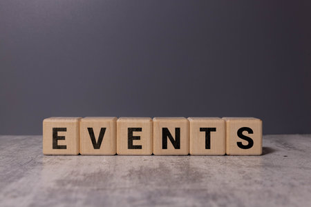 Upcoming Text on Wooden Cubes with Red Background Countdown, Event Announcement, and Future Planning Concept.の写真素材