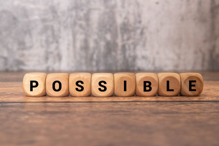 Man hand writing possible from impossible. Motivation conceptの写真素材