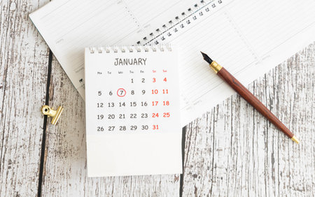 Cube shape calendar for January 07 on wooden surface with empty space for textの写真素材