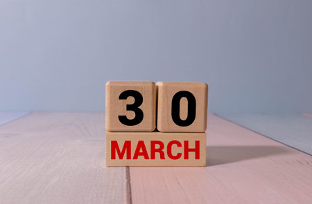 March 30, Date design with number cube on white table, cover design in natural concept.