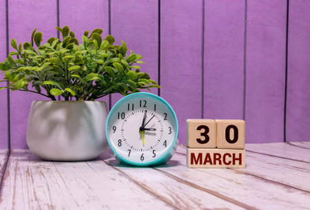 March 30, Date design with number cube on white table, cover design in natural concept.