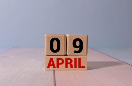 Wooden calendar displaying the date as April 09. This calendar serves as a decorative piece, marking...