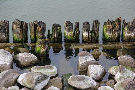 The pier wooden dock with stonesの写真素材