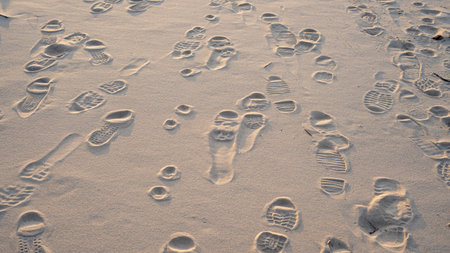 Prints From Various Footwear on Sand. Urban Background. Texture of Yellow Sand With Traces of...