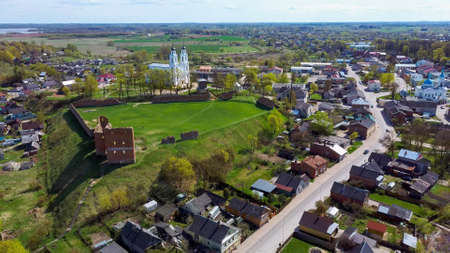 Aerial View of the Ludza Medieval Castle Ruins on a Hill Between Big Ludza Lake and Small Ludza Lake and the Roman Catholic Church in Backgroundのeditorial素材