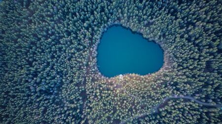 Aerial View of the Devil Lake Velnezers , Cortoks or Chortock Lake. A Transparent Velnezers Lake is 17 Meters Deep and Located the Latgale Aglona, Latvia .の写真素材