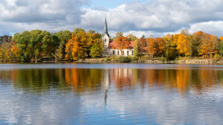 Autumn Landscape of Koknese Evangelical Lutheran Church and River Daugava Located in Koknese Latvia.の写真素材
