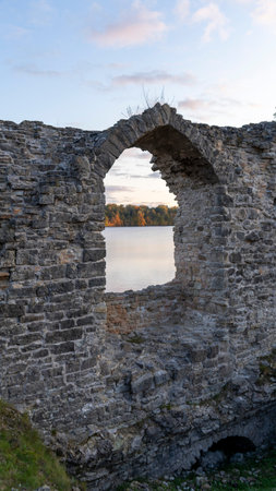 Autumn Landscape of Old Koknese Castle Ruins and River Daugava Located in Koknese Latvia. Medieval Castle Remains in Koknese.の写真素材