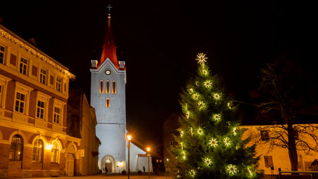 Ancient St. John`s Church at Night Located in Cesis, Latvia. Cesis Medieval Castle and City in Background. Cristmas Time Night Shot.のeditorial素材