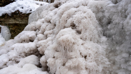 Dauda waterfall in winter. Small Frozen waterfall in Gauja national park, Sigulda, Latvia.の写真素材