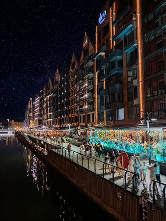 GdaÅ„sk Old Town - the Historical Port Crane Gate and Houses on the MotÅ‚awa River in the...