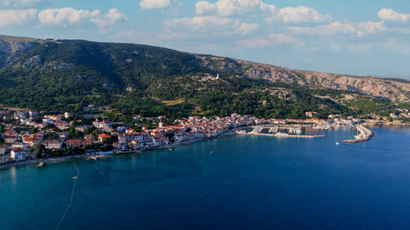 Baska Beach and Coastline With Clear Turquoise Water, Marina Boats, City Street, Sunny Summer Sunset Aerial View on Krk Island, Croatia Adriatic Sea, Vela Plaza Beach, Mountains and Campsite Cityscapeの写真素材