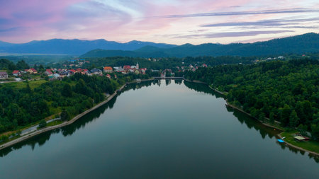 Aerial View of a Lake in Fuzine, Croatia and Highway Bridge Viaduct at Sunset. Panoramic View of the Village of Fuzine Located in the County of Primorje-gorski Kotar, Croatia.の写真素材