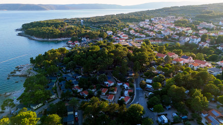 Aerial View of Krk, the Capital City of the Croatian Island of Krk, Adriatic Coast, With Harbor and Red Tiled Roofs. Blue Sea,with Sailboats, Sandy Beaches and the Historic Old Town at Sunset Croatiaの写真素材