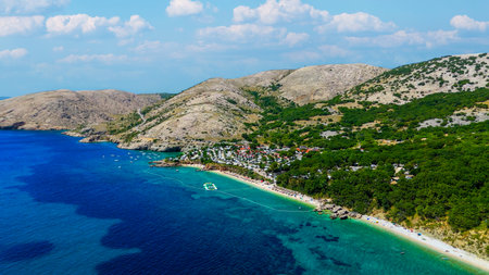 Campsite at Campig Skrila, Krk Island, Stara Baska Croatia, Aerial View of the Mountains and Coast With Boats, Beaches and Adriatic Sea. The Seaside Rv Campmobiles on a Summer Beautiful Coastlineの写真素材