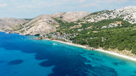Campsite at Campig Skrila, Krk Island, Stara Baska Croatia, Aerial View of the Mountains and Coast With Boats, Beaches and Adriatic Sea. The Seaside Rv Campmobiles on a Summer Beautiful Coastlineの写真素材
