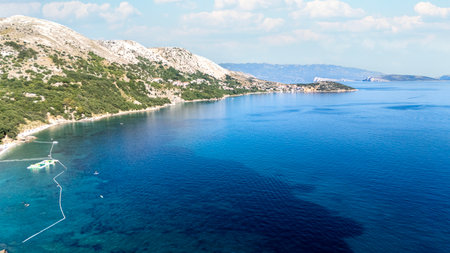 Campsite at Campig Skrila, Krk Island, Stara Baska Croatia, Aerial View of the Mountains and Coast With Boats, Beaches and Adriatic Sea. The Seaside Rv Campmobiles on a Summer Beautiful Coastlineの写真素材