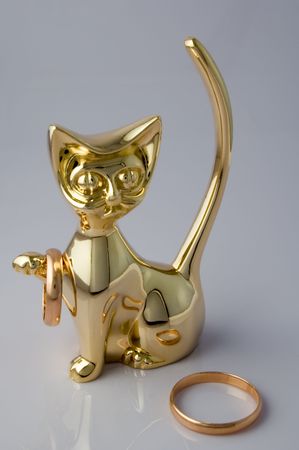 Figurine in an image of a cat with gold ornamentsの写真素材