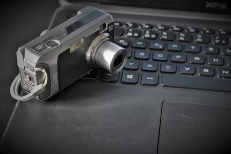 An Image of a computer and a cameraの写真素材