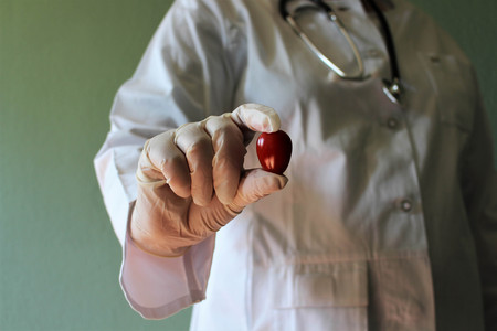 An image of a doctor with a tomatoの写真素材