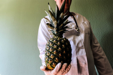 An image of a doctor with pineappleの写真素材