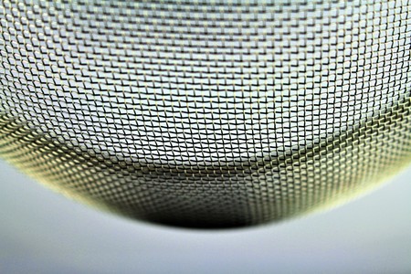 An image of a metal sieve - macro - focus in the centerの写真素材