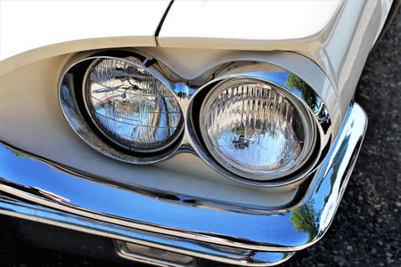 An Image of a Classic car headlight - muscle car - Kaunitz / Germany - 2017 May 27.
