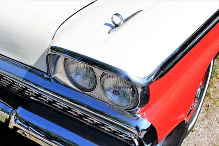 An Image of a Classic car headlight - muscle car - Kaunitz / Germany - 2017 May 27.