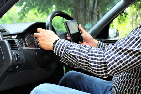 An image of car and mobile phone